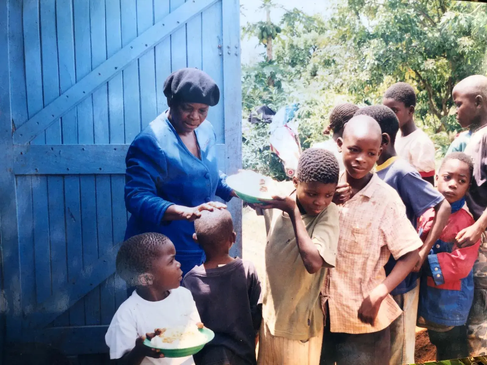 Patricia Pagaja serving meals to children at the orphanage