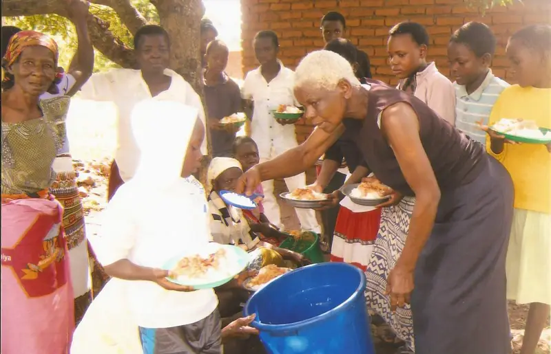 Mrs. Patricia Pagaja Serving Meals